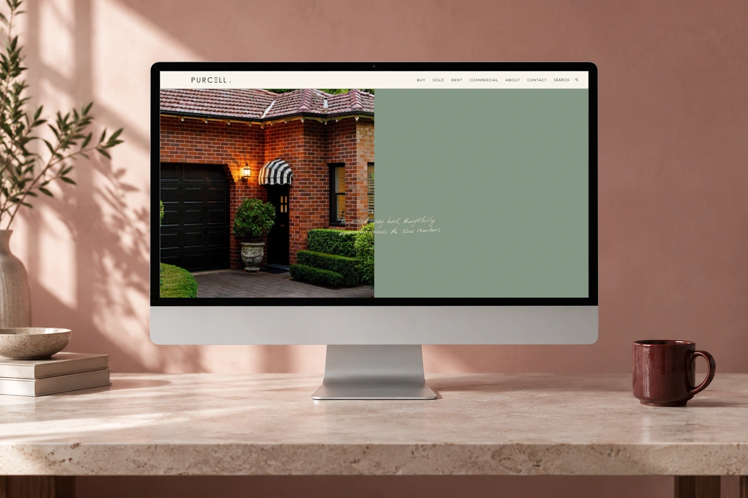 Purcell Property actual website hero inside a desktop computer